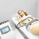 Laser lipo equipment. Cosmetic fat reduce treatment. Woman in medicine salon. Anti cellulite procedure.